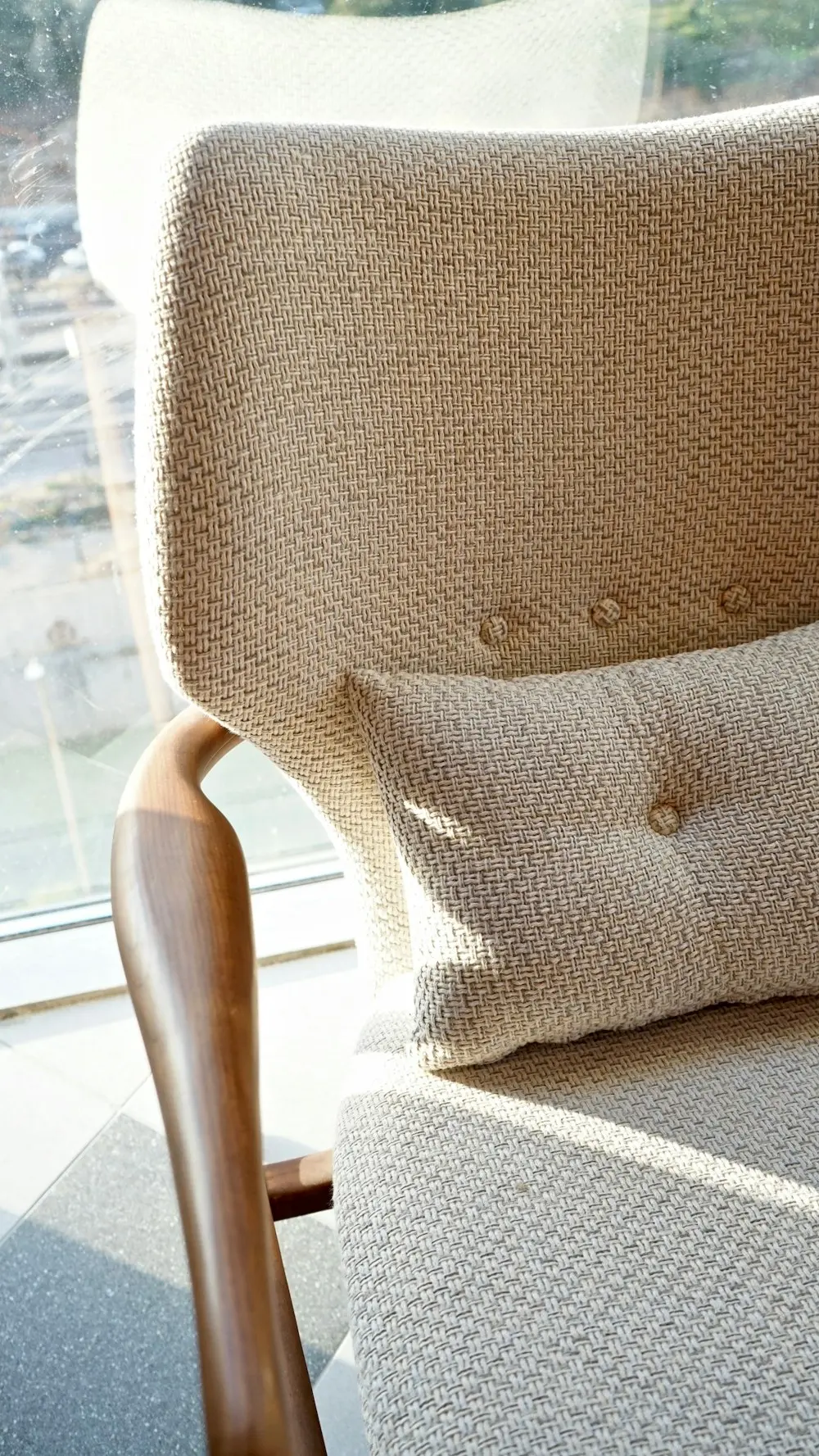 Restored buttoned armchair beside a window Lee Verity Upholstery Wakefield